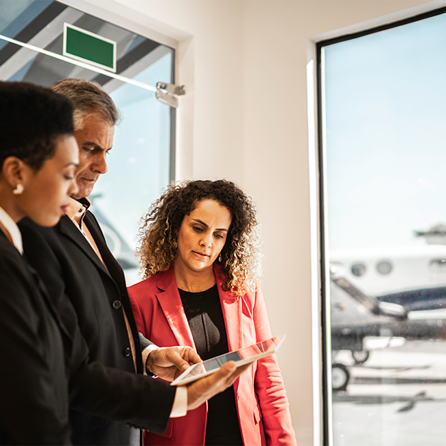 Three people discussing inflight connectivity