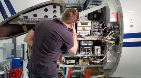 FSE working in nose of plane