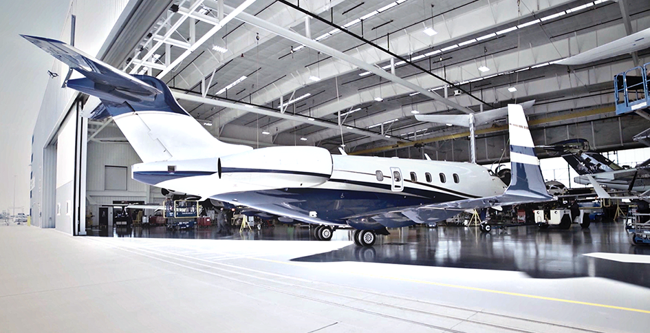 Airplane pulling into building