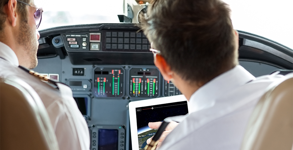 Pilot Using Tablet Cockpit App Inflight