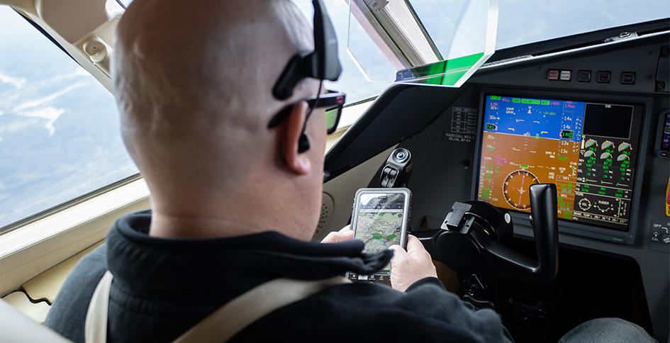 Pilot using smartphone in cockpit