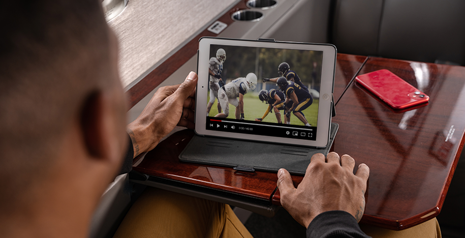 Man Streaming Football on Plane