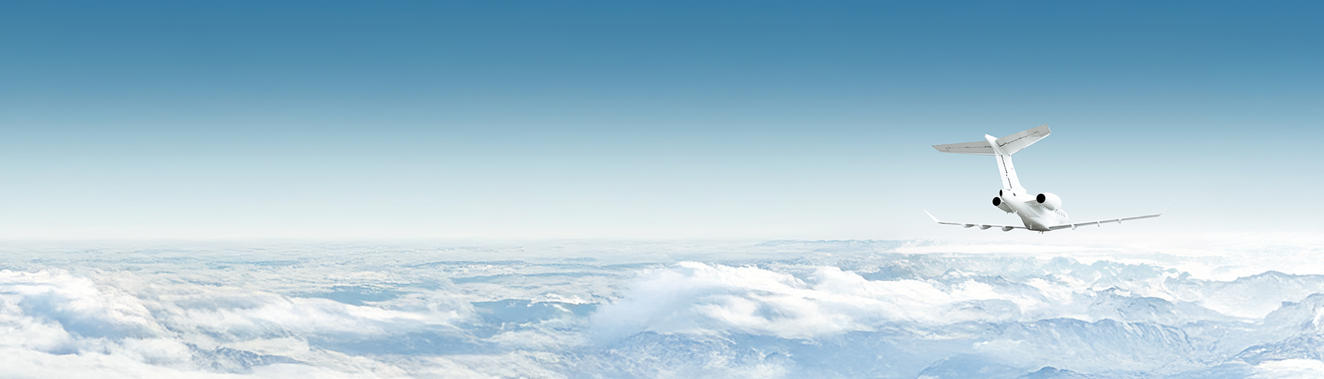 Bombardier 3500 flying with clouds over the horizon