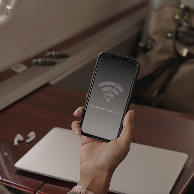 Woman holding phone no internet signal