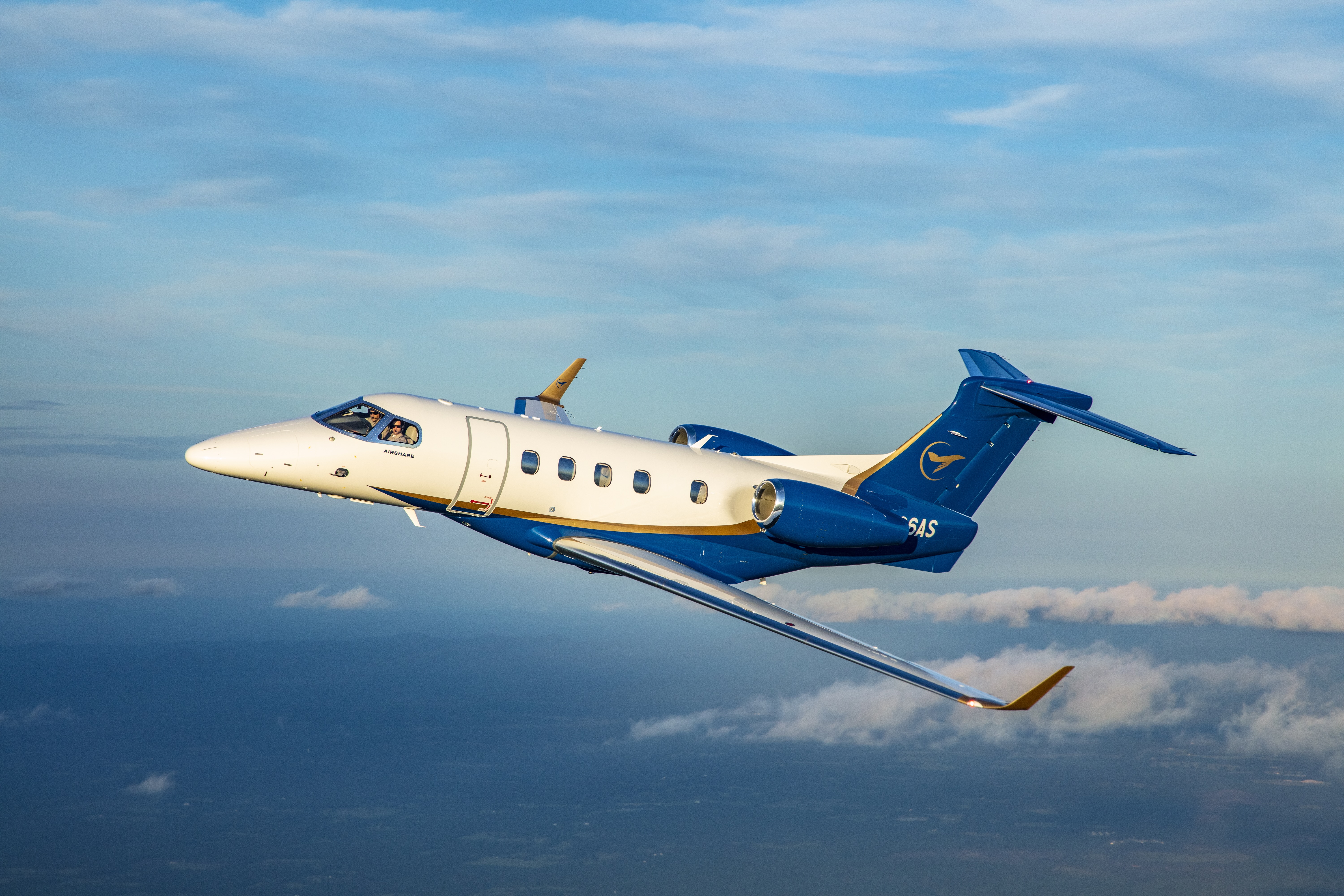 Phenom 300 flying through the sky