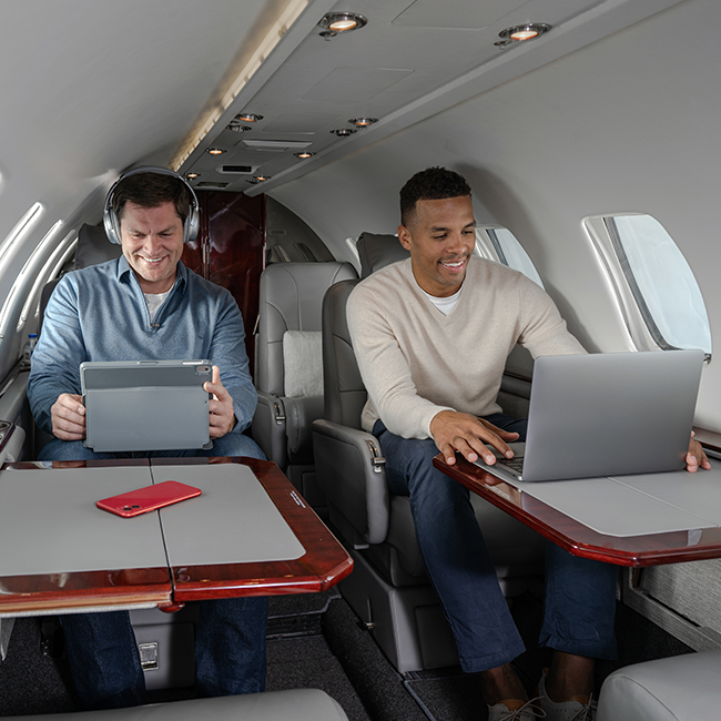 Two Men  Working on Multiple Devices 