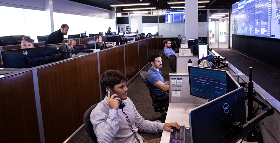 Row of Business Men Behind Computers